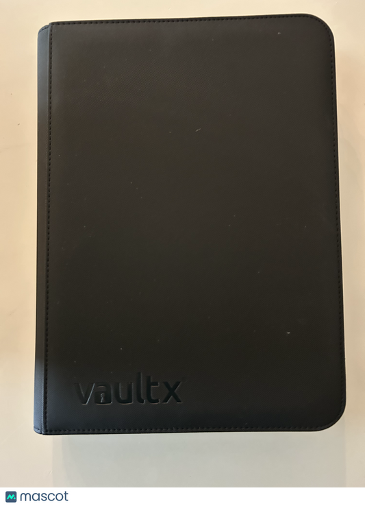 Black Vault X trading card binder with textured cover on a light surface